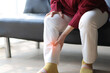 Senior woman with osteoarthritis has leg pain.