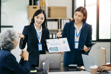 Businessman working as a team start meeting the new marketing project plan By business people using tablets and graph documents Calculate the amount of money for the project.