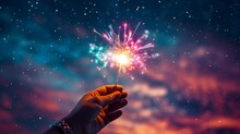 Christmas Or New Year Themed Greetings, Invitations, Or Social Media Posts A Hand Holds A Sparkler In The Night Sky With Stars And Clouds.