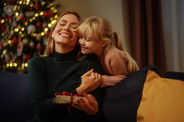 Wall Mural - Mother and daughter hugging