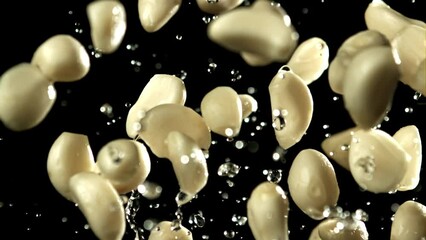 Wall Mural - Garlic flies up with drops of water. Filmed on a high-speed camera at 1000 fps. High quality FullHD footage