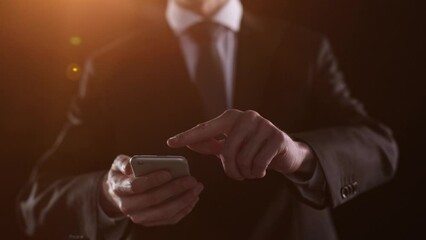 Side view of a man's hand presses a finger on a smartphone. Mock up for your design, copy space.