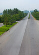 © Eric Lafforgue - North Korean man riding a bicycle on an empty highway, North Hwanghae Province, Kaesong, North Korea