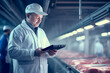 an inspector in a meat processing plant examining the quality of the meat