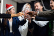 © NVB Stocker - Closeup hand holding glassware. Business people celebrate making a toast on event party at office. Celebration Success Concept
