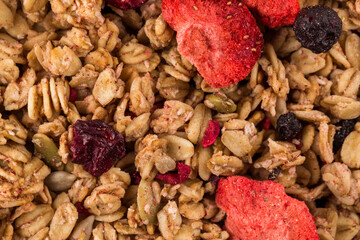 Wall Mural - Muesli oat cereals close up background with dry fruits