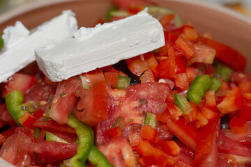 Wall Mural - Cucumber salad with tomatoes, cheese,