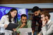 © YURII MASLAK - A team of young multinational business people are working on a startup. New generation of startups. communication network. Management strategy. Digital transformation. multinational professional staff