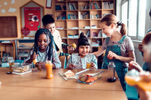 Children Enjoy A Healthy Snack Time Together In The Classroom