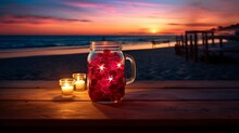 Raspberry Juice In A Mason Jar Glass, On A Table Lit By Beach Bonfire, Stars Starting To Twinkle Above.
