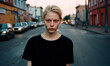 © Manu Prats - Serious woman in plain black t-shirt, standing in the street at evening