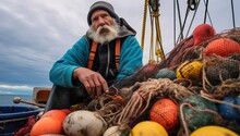 Fisherman On Boat With Nets And Buoys