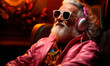 © Manu Prats - Relaxed senior man listening music with headphones and sunglasses