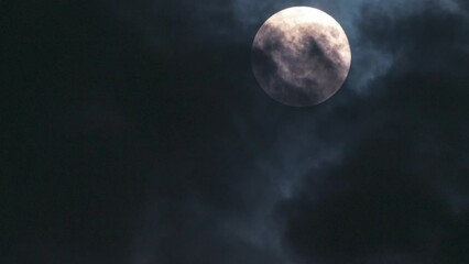 Wall Mural - time lapse of full moon and clouds in close-up. mystical and atmospheric night sky video. fast movem