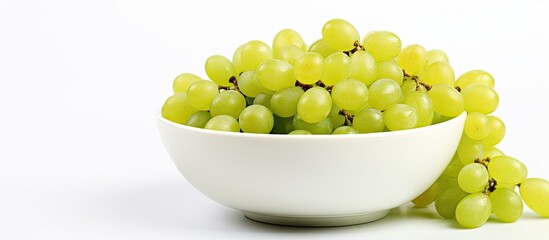 Poster - A grouping of green grapes is arranged together in a ceramic bowl with plentiful room surrounding it over a plain white background creating a vibe of the autumn season