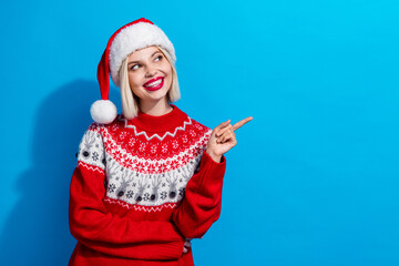 Wall Mural - Portrait of lovely positive girl look indicate finger empty space newyear proposition isolated on blue color background