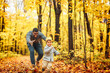© Louis-Paul Photo - Father and son having fun running in autumn park