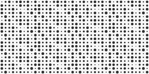 Leinwandbilder - A grid of different sized dots. Black shapes are arranged in a grid on a white background.