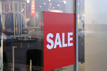 Wall Mural - Red sale sign on the window shop in the shopping mall