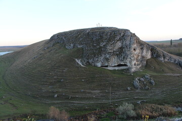 Wall Mural - A large rock on a hill