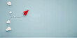 Red paper plane flying in the sky blue background