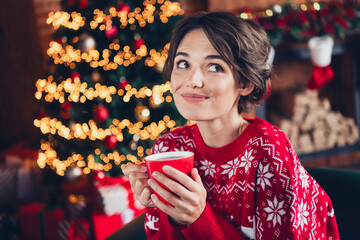 Wall Mural - Photo of young beautiful girl wear red ugly ornament sweater drinking eggnog new year eve atmosphere dreaming isolated indoors background