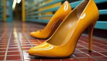 Yellow High-heeled Women's Shoes On Red Small Tiles, Close-up