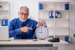 © Elnur - Old male employee in time management concept