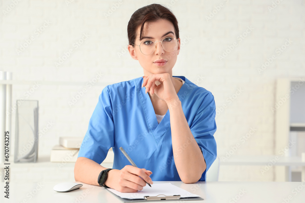 Female doctor video chatting with patient in office