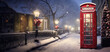 Christmas scene of bright red phone box on country Road in winter snow full.