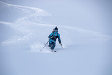 Anonymous Person Descending Snowcapped Mountain