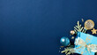 Luxury Xmas banner design. Dark blue Christmas background with gift box, fir branches, luxury ball ornaments.