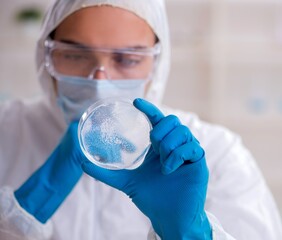 Young male chemist working in the lab