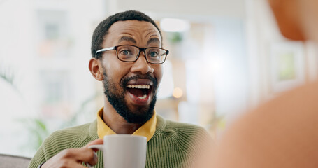 Canvas Print - Coffee, surprise conversation and excited man at home on a living room sofa with a man and hot drink. Couple, tea and smile with communication and conversation together with love and support on couch