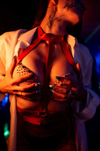 Beautiful Go-go Dancer In Lingerie And White Shirt Posing In A Nightclub. Close-up Of Breasts. Party Concept, Halloween, Nightclub