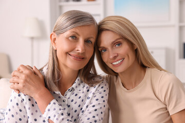 Sticker - Happy mature mother and her daughter at home