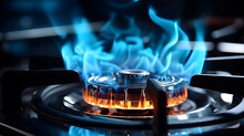 Close Up Shot Of Blue Fire From Domestic Kitchen Stove Top. Gas Cooker With Burning Flames Of Propane Gas. Gas Supply Chain And News. Global Gas Crisis And Price Rise.