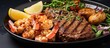 Close up vertical shot of barbecue beefsteaks and shrimps on a grey concrete background in a surf and turf meal