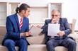 © Elnur - Two businessman discussing business in office