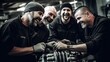 Group of male mechanics in auto repair shop