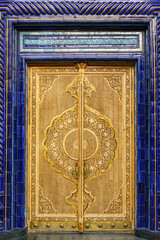 Wall Mural - Carved antique wooden doors with patterns and mosaics.