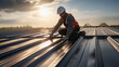 © EmmaStock - construction technician installing metal sheet roof and sky