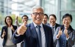 © Kowit - Portrait of successful senior businessman standing with his arms crossed businessman and businesswoman over big group of businesspe. Caucasian male entrepreneur in suit looking at camera with a smile.