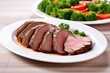 © Alfazet Chronicles - sliced beef brisket on a white plate