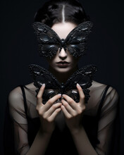 Beautiful Woman Holding Black And Purple Butterfly