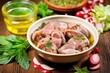 © Alfazet Chronicles - rabbit meat in bowl with herbal marinade
