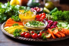 Pouring Delicious Hummus Over A Fresh Vegetable Platter
