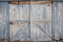 Rustic Barn Door With Peeling Paint. A Weathered Barn Door Showing Signs Of Peeling And Fading Paint.
