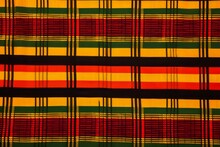 Kwanza Kente Cloth Background In Yellow, Green, Red And Black
