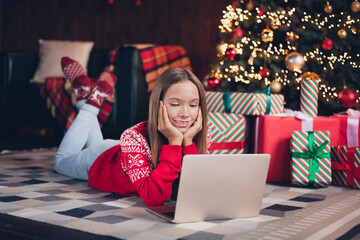 Poster - Photo of cute cheerful small girl wear red print sweater ordering new year xmas presents modern device indoors house room